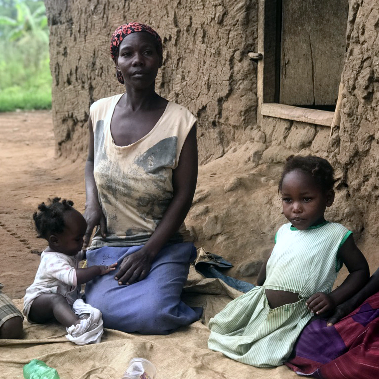 Photo of mother and two children being helped by the Shalom Program